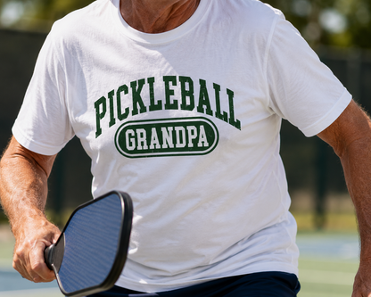 Pickleball Grandpa shirt on clothing rack in bright Mediterranean studio with olive tree