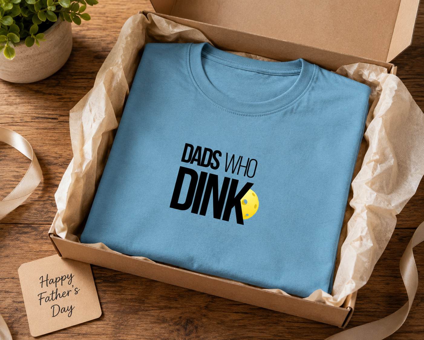 Dad wearing Dads Who Dink pickleball shirt at backyard barbecue
