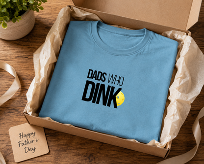 Dad wearing Dads Who Dink pickleball shirt at backyard barbecue