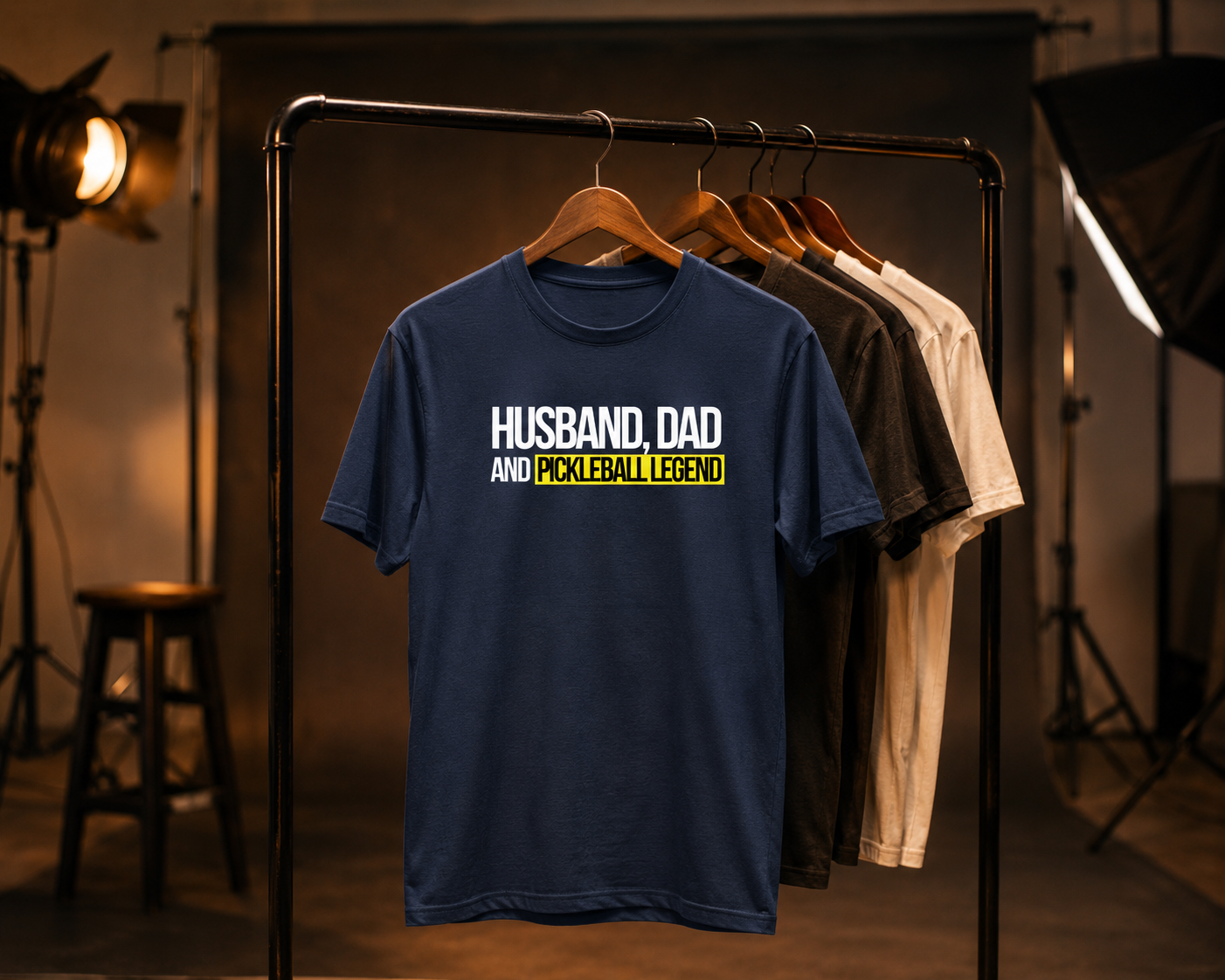 Husband Dad Pickleball Legend shirt on clothing rack in moody studio