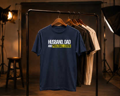 Husband Dad Pickleball Legend shirt on clothing rack in moody studio