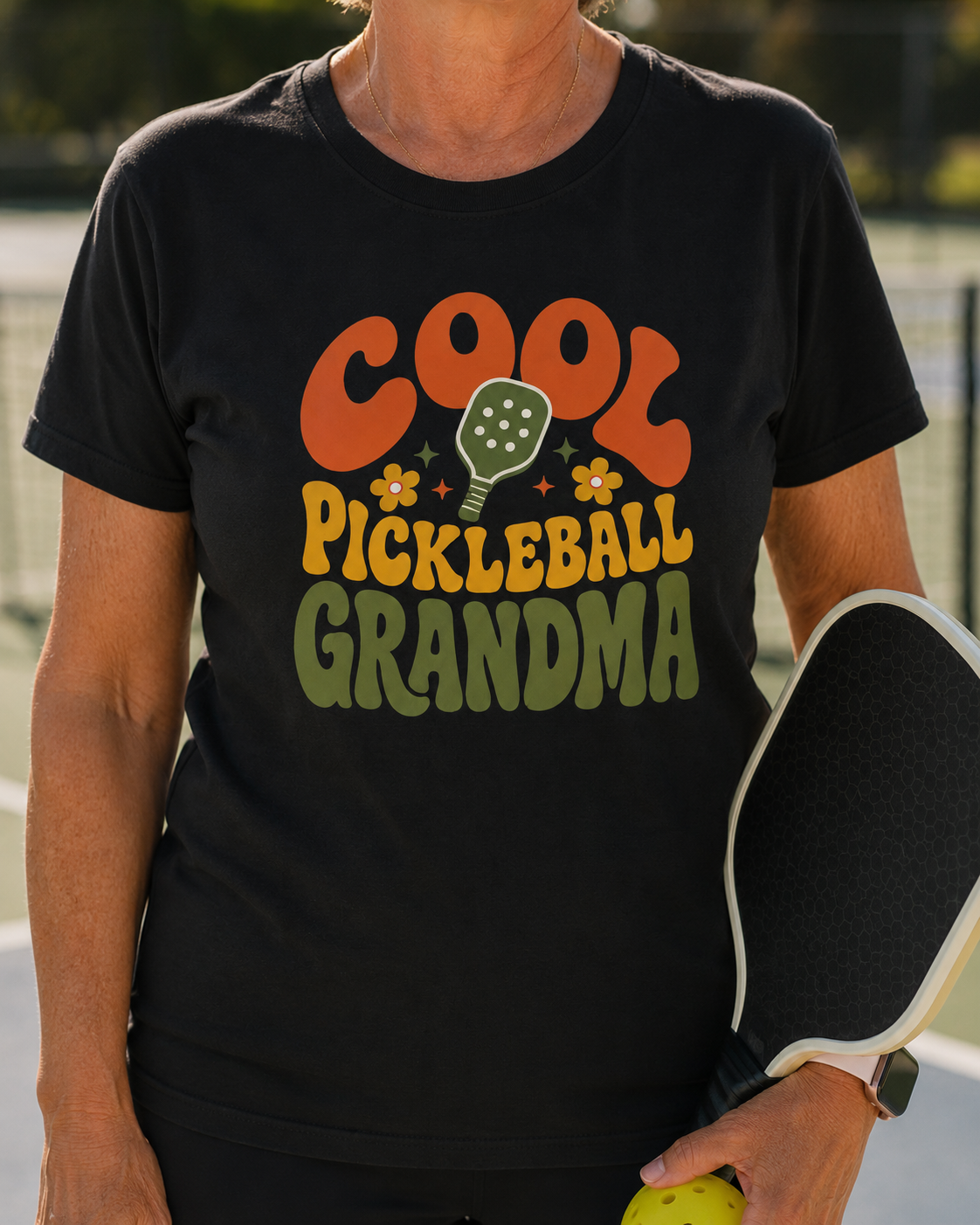 Close-up of woman wearing Cool Pickleball Grandma shirt on pickleball court
