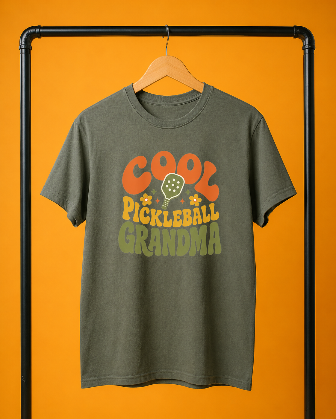 Cool Pickleball Grandma shirt on clothing rack in colorful mustard yellow studio