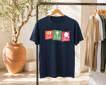 Eat Pray Dink pickleball shirt navy in bright Mediterranean studio with olive tree